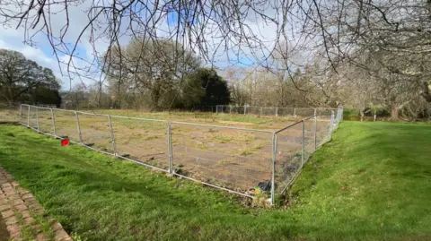 The area of land that was occupied by Matford Offices - the concrete base is still there and the area is surrounded by fencing.