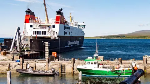 ferry and small boats at dock