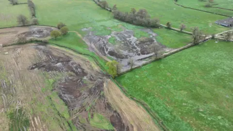 An aerial view of slurry spread across three fields. 