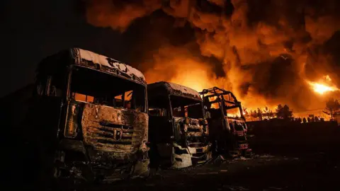Anadolu via Getty Images Fire breaks out at the Shahran oil depot after US and Israeli attacks, leaving numerous fuel tankers and vehicles in the area unusable in Tehran, Iran on March 8, 2026.