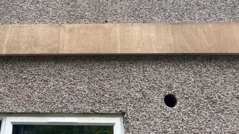 Llelo Grufudd a hole in the side of a house