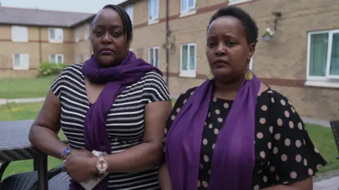 BBC Jade Morris and Irene Muthemba outside a housing block