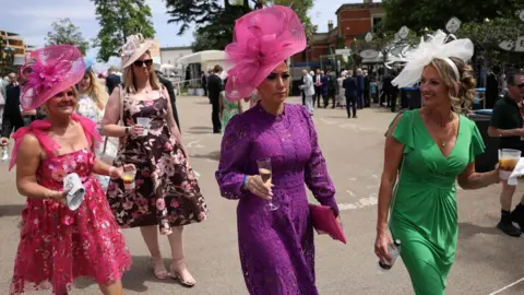 NEIL HALL/EPA/Shutterstock Race-goers attend the first day of Royal Ascot.