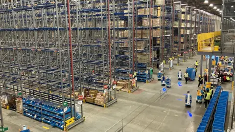 A warehouse with rows and rows of 16m high shelving full of stock