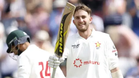 Brian Bennett raises his bat