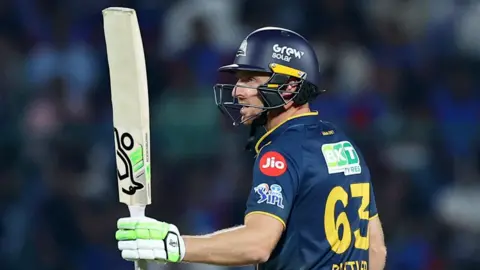 Jos Buttler salutes the crowd after reaching fifty for Gujarat Titans