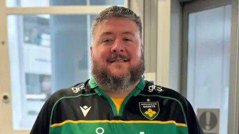 BBC Simon Stacey wearing a Northampton Saints team shirt