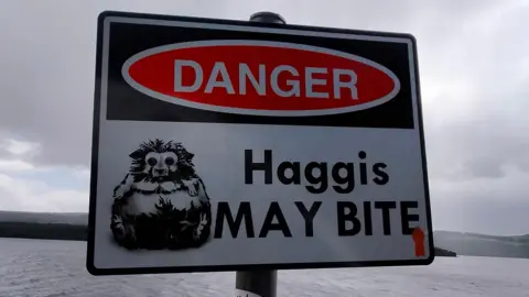 Sharon Humphrey A sign warning Loch Ness visitors of the dangerous and ellusive Haggis