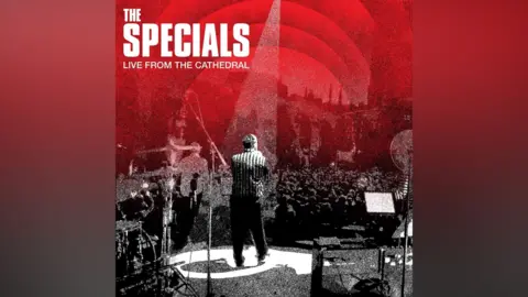 Universal Music Group The artwork for the album Live from the Cathedral shows a black and white image taken from behind Terry Hall seen on stage with the audience in front of him