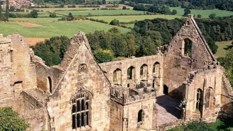 English Heritage An aerial photo of the ruins of Wingfield Manor.