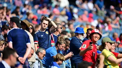 Getty Images stadium stand with boy standing in Scotland strip