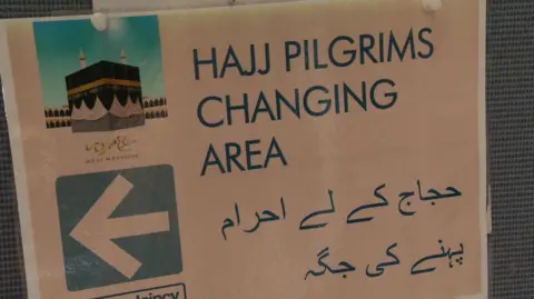 Sign for changing rooms for Hajj pilgrims at Manchester Airport