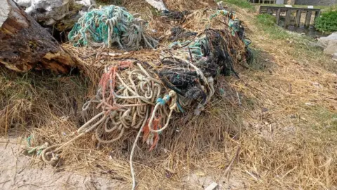 Andy Pigg  A pile of fishing tackle covered in storm debris