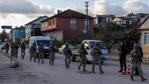Reuters Turkish special forces team leaves the site of an operation on a house believed to contain suspected Islamic State militants in Yalova province, December 29, 2025.