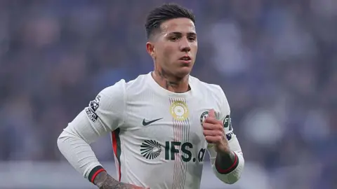 Enzo Fernandez running while playing for Chelsea at Everton