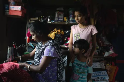 Swastik Pal Soma Das sells clothes using the money, supporting her seven-member household in West Bengal