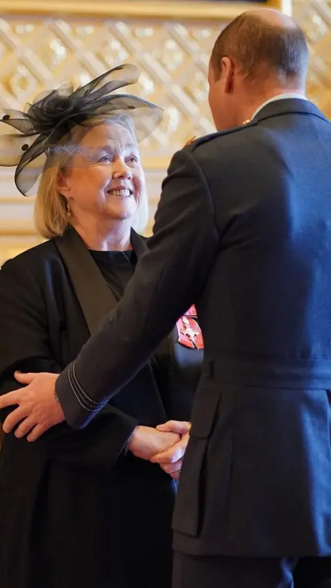 PA Media Quirke receiving her MBE from the Prince of Wales at Windsor Castle in 2023