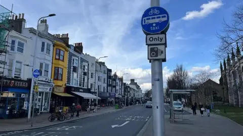 George Carden/BBC General shot of York place bus gate in Brighton near St Peter’s church showing a blue buses only sign