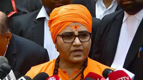 Former BJP MP Sadhvi Pragya Singh Thakur leaves the special NIA court in the 2008 Malegaon blast case on May 8, 2025 in Mumbai, India