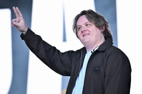 Getty Images Lewis Capaldi gives the peace sign on stage at Glastonbury