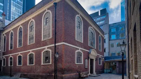 Louis Berk Bevis Marks Synagogue, surrounded by buildings in the City of London