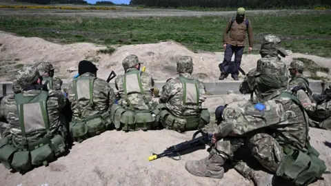 AFP Ukrainian soldiers take part in trench warfare exercises at a British Army military base in Northern England on June 2, 2023