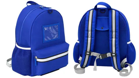 A representative image of the rucksack. It is blue with a large front pocket and white reflective stripes.