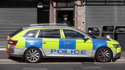 Police car at scene of stabbing in Newry
