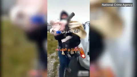 Blurred still image from video clips shows people being taken out of a car