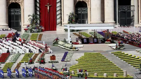 Getty Images St Peter's Square decorated with colourful flowers as Pope Leo XIV presides over Easter Mass 