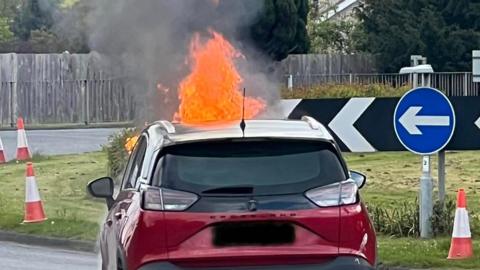 Front of car on fire
