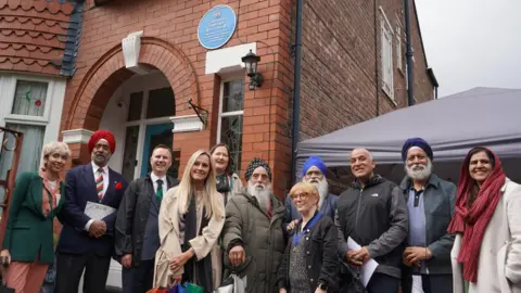 Trafford Council handout Gyani Ji's relatives were among the people who turned out for the unveiling ceremony of the blue plaque at his former home.