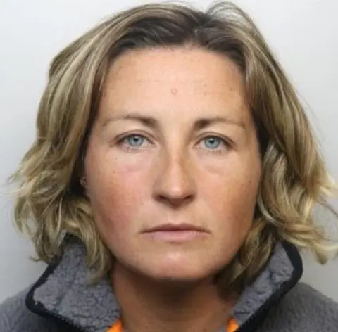 Dyfed-Powys Police Police custody photos of Nerys Lloyd. She has shoulder-length blonde hair and blue eyes, and looks straight at the camera with a neutral expression. 