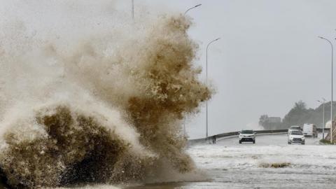 Waves crash on the coast of Sansha town, Fujian Province, as Typhoon Gaemi approaches