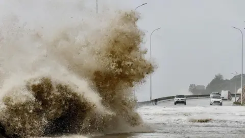 Reuters Waves crash on the coast of Sansha town, Fujan Province, as Typhoon Gaemi approaches