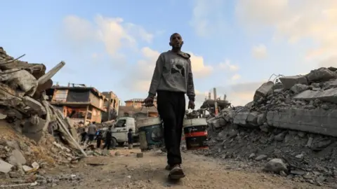 Reuters A Palestinian carries water in Jabalia refugee camp in Gaza