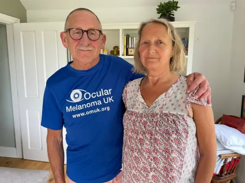 Anne Haslam and her husband Miles who still need to raise more than £80,000 to pay for her cancer treatment
