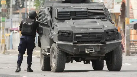 A police officer in Port-au-Prince, Haiti. Photo: 26 February 2025