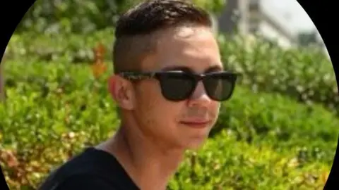 SUPPLIED A picture of a man wearing black sunglasses