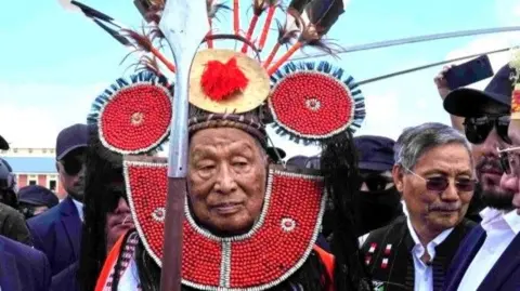 National Socialist Council of Nagaland (Isak-Muivah) leader Thuingaleng Muivah receives a warm welcome on his return to his native village of Somdal after fifty years, in Ukhrul on Wednesday