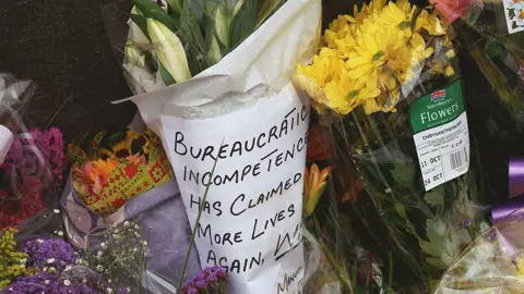 Getty Images Bouquets of flowers were left at the crash site