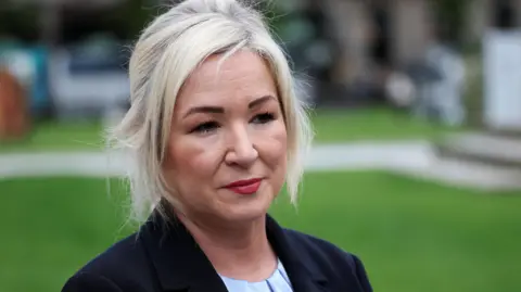 Reuters Michelle ONeill with blonde hair wearing a black blazer