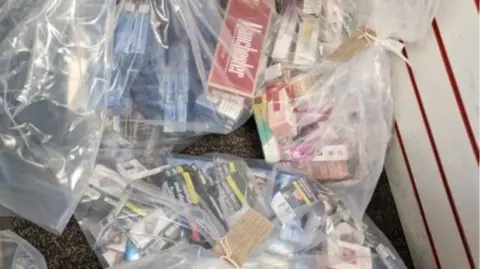 Lancashire Police Bagged contraband from the raid.