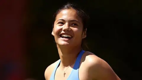 Emma Raducanu smiles after her victory
