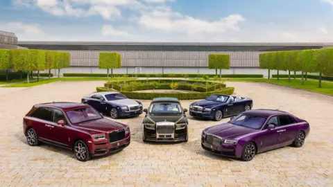 A Rolls-Royce Phantom, Ghost, Cullinan and Spectre displayed on Festival’s Laundry Green, next to Goodwood House