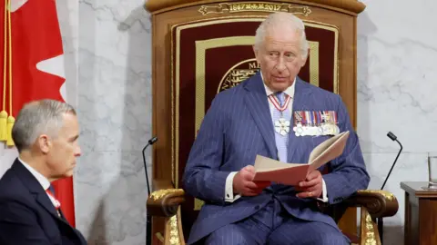  King Charles delivers a speech from the throne next to Canada's Prime Minister Mark Carney at the Senate Chamber in Ottawa, Ontario, Canada.
