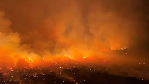 Ronan Dugan an evening picture of flames burning across dry land