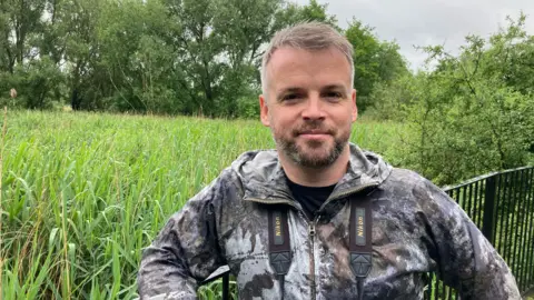 Dr Sean McCormack, who has a beard and is looking straight at the camera