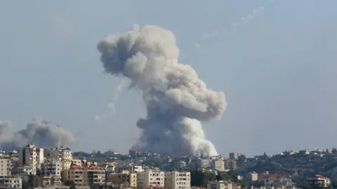 Getty Images Smoke billows from a site targeted by Israeli shelling in Lebanon