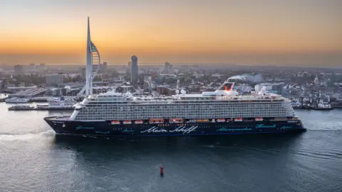 Portsmouth International Port The huge Mein Schif, also sailing past the tower.
